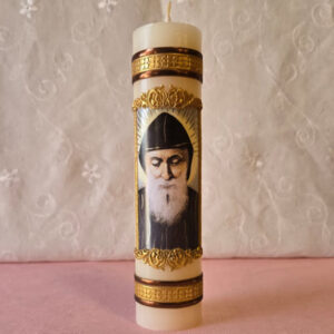 This candle features Saint Charbel, It's made in Mexico and comes in a white box with clear wrapping. Candle measures 2  by 8 inches tall and weighs 12.5 oz. Vela con imagen de San Charbel, hecha en Mexico, viene en una caja blanca con envoltura transparente. Vela 2 x 8 pulgadas de alto 12.5 Oz.